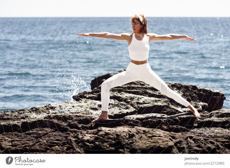 Young woman doing yoga in the beach Lifestyle Beautiful Wellness Relaxation Meditation Summer Beach Ocean Sports Yoga Human being Feminine Woman Adults Body 1