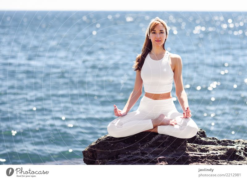 Young woman doing yoga in the beach Lifestyle Beautiful Wellness Relaxation Meditation Summer Beach Ocean Sports Yoga Human being Feminine Woman Adults Body 1