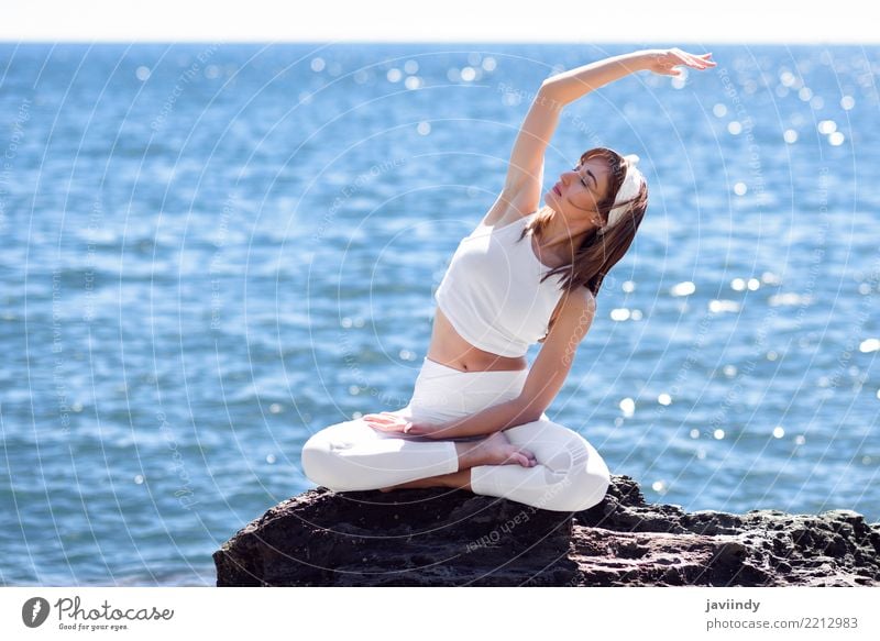 Young woman doing yoga in the beach. Lifestyle Beautiful Wellness Relaxation Meditation Summer Beach Ocean Sports Yoga Human being Woman Adults Nature Fitness