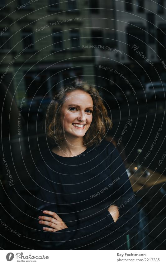 Young blonde woman looks through window into camera Lifestyle Joy Happy Harmonious Contentment Feminine Young woman Youth (Young adults) 1 Human being