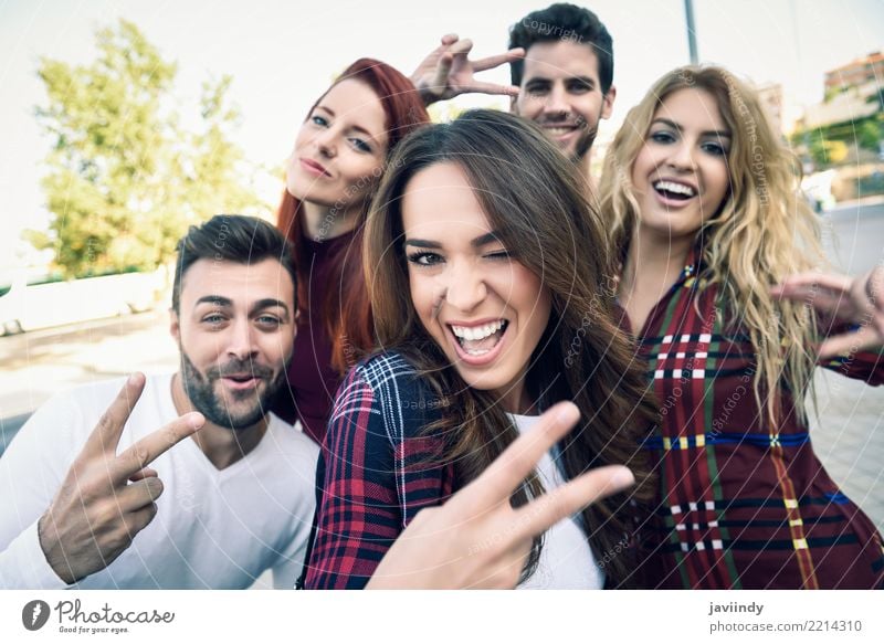 Group of friends taking selfie in urban park Lifestyle Joy Happy Beautiful Leisure and hobbies Telephone PDA Camera Masculine Feminine Woman Adults Man