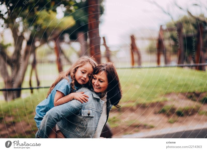 Mother and daughter hugging each other in the park Lifestyle Joy Happy Parenting Human being Feminine Child Girl Woman Adults Parents Family & Relations 2 Park