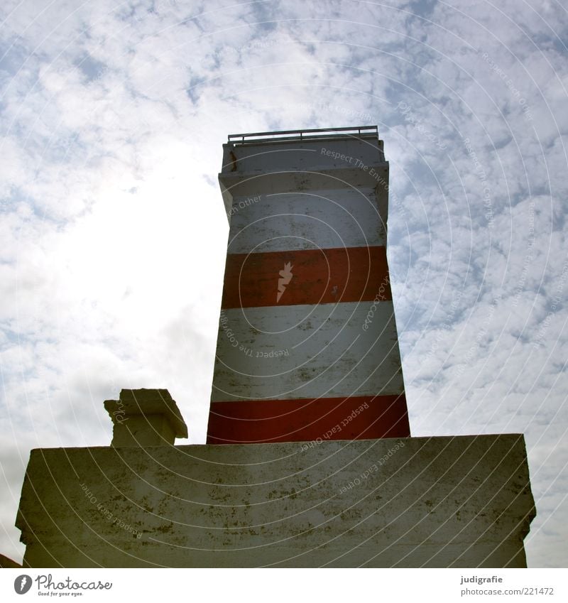 Iceland Sky Clouds Beautiful weather Garður Lighthouse Wall (barrier) Wall (building) Facade Sharp-edged Cold Red Navigation Ocean Maritime Striped Colour photo