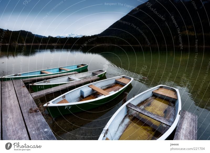 Boat trip with wet feet Nature Alps Mountain Snowcapped peak Lake Rowboat Old Blue Green Black White Calm Idyll Stagnating rear lake Ramsau near Berchtesgaden