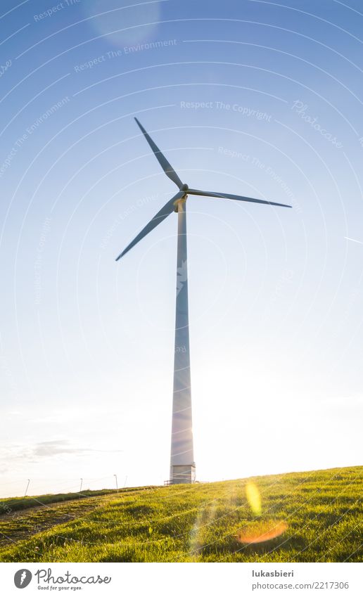 Wind turbine in back light Wind energy plant Renewable energy Eco-friendly Nature Sky Sun Energy industry Resource Responsibility Future Futurism Electricity