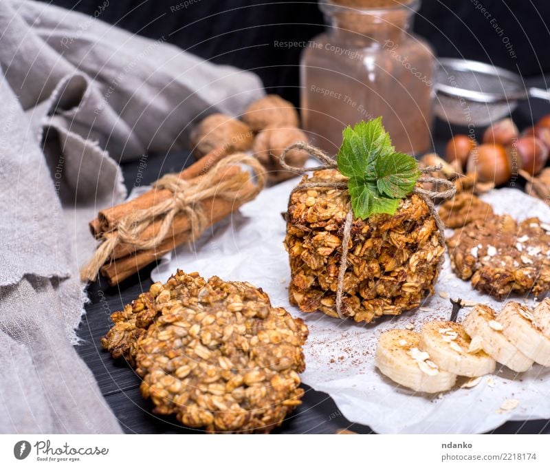 round cookies made from oat flakes Dessert Candy Nutrition Breakfast Lunch Vegetarian diet Diet Hot Chocolate Table Wood Eating Delicious Natural Brown White