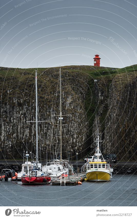 safeguarded Landscape Clouds Spring Bad weather Rock Mountain Coast Deserted Harbour Lighthouse Navigation Fishing boat Sport boats Yacht Sailboat Blue Brown