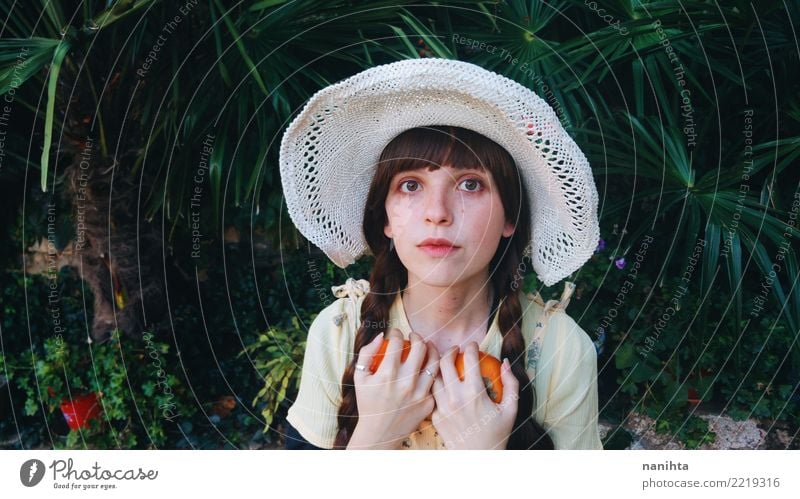 Young woman holding two oranges Food Vegetable Fruit Orange Picnic Lifestyle Style Beautiful Human being Feminine Youth (Young adults) 1 18 - 30 years Adults