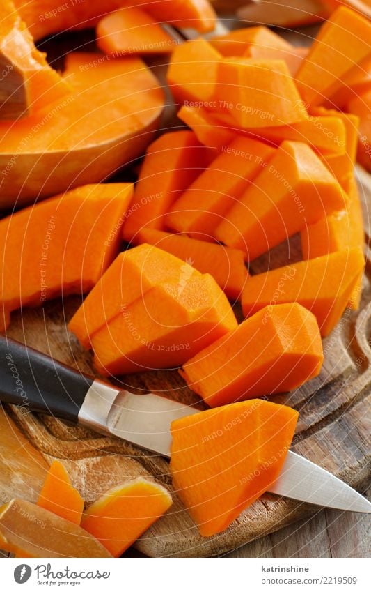 Pumpkin slices on a white wooden background close up Vegetable Nutrition Eating Vegetarian diet Thanksgiving Hallowe'en Autumn Fresh Natural Yellow agriculture