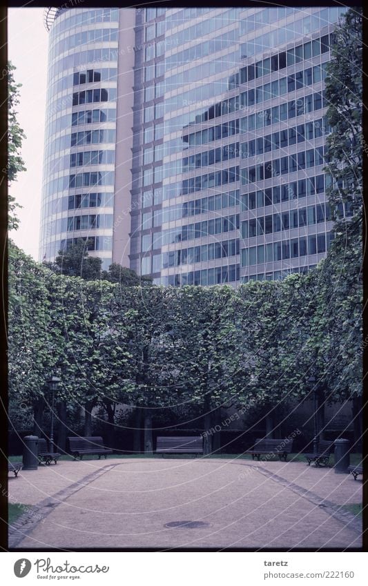 No time for a break Park Town Deserted High-rise Facade Sharp-edged Large Modern Esthetic Brussels Park bench Colour photo Exterior shot Copy Space top Day