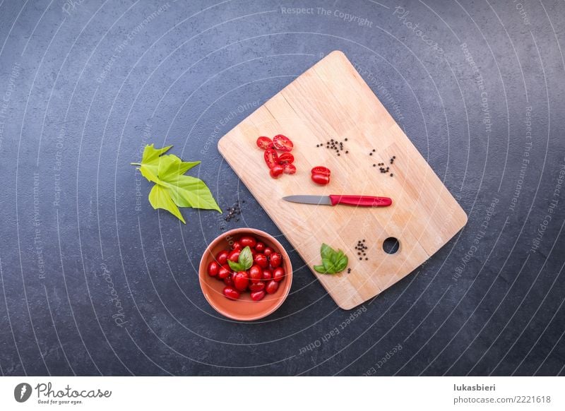 Sliced cherry tomatoes on cutting board Vegetable Tomato Fresh Leaf carver Summer Spring Italian Food Delicious Refreshment Stone Rustic Knives Vitamin