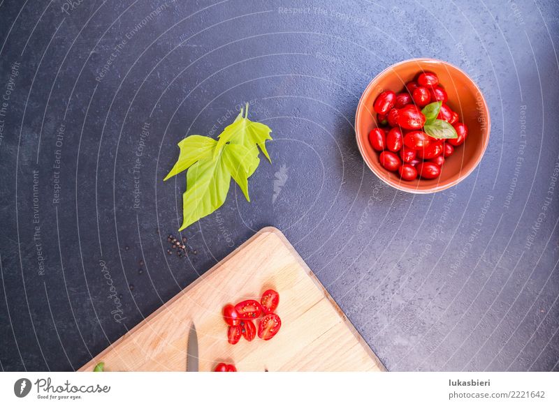 Cherry tomatoes with chopping board Vegetable Herbs and spices Aperitif Bowl Tomato cherry Near Basil cutting board Sliced Fresh Leaf Summer Spring Kitchen