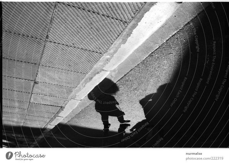 shade in the corner Human being 1 Art Environment Beautiful weather Places Wall (barrier) Wall (building) Pedestrian Sign Walking Dark Sharp-edged Moody