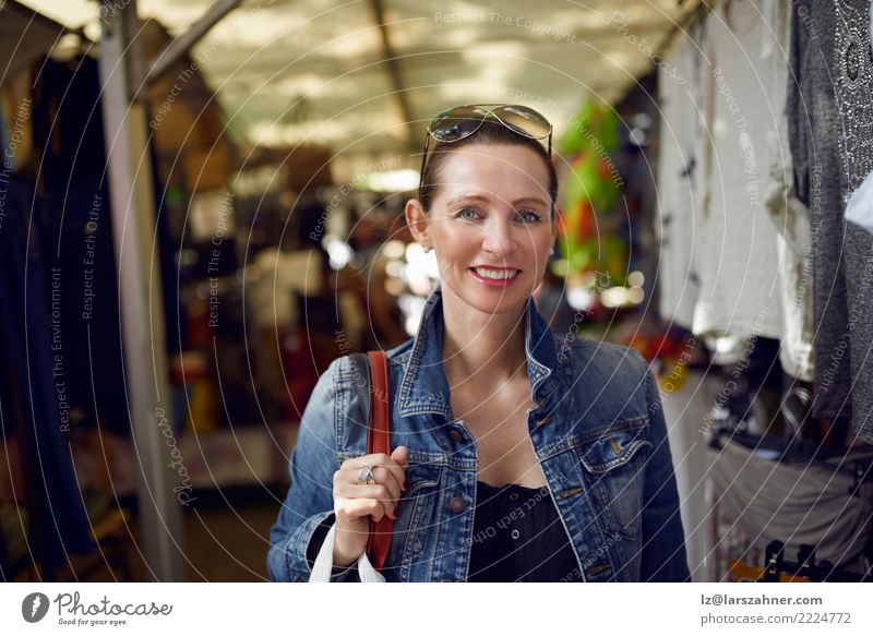 Happy woman shopping at an outdoor market Shopping Face Leisure and hobbies Vacation & Travel Tourism Summer Woman Adults 1 Human being 30 - 45 years Warmth