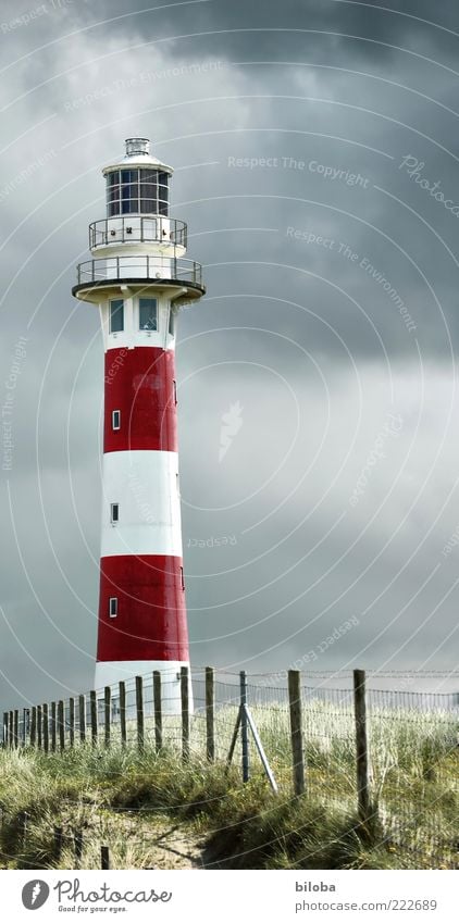 lighthouse romance Clouds Storm clouds Lighthouse Navigation Old Red White Moody Thunder and lightning Orientation marks North Sea HDR Deserted Fence Grass Dune