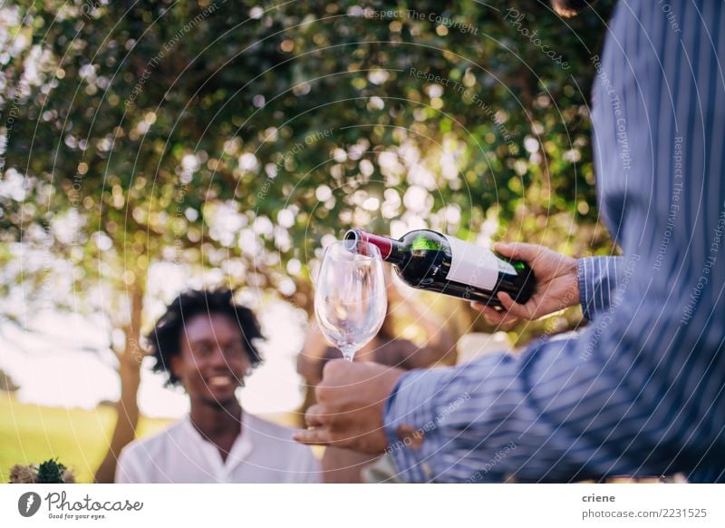 Waiter pouring red wine in wine glass Alcoholic drinks Summer Garden Restaurant Feasts & Celebrations Wedding Joy Happiness Bottle of wine party waiter