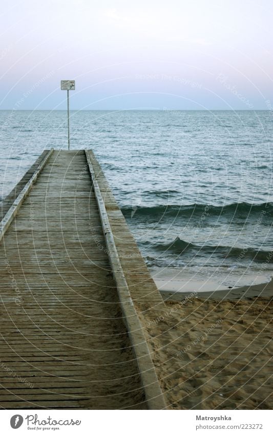 NO! jump Sand Sky Summer Waves Coast Beach Ocean Footbridge Water Signs and labeling Footprint Vacation & Travel Colour photo Exterior shot Deserted Twilight