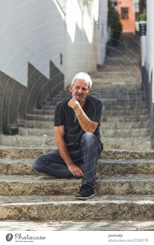 Mature man sitting on steps in the street. Lifestyle Happy Human being Masculine Man Adults Male senior 1 45 - 60 years 60 years and older Senior citizen Street