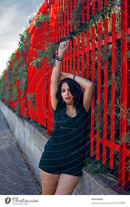 Young woman in street red Lifestyle Joy Beautiful Human being Feminine Youth (Young adults) 13 - 18 years 18 - 30 years Adults Village Wall (barrier)