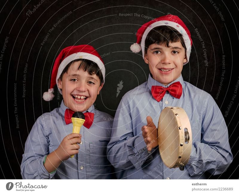 children singing Christmas carols at Christmas Lifestyle Joy Entertainment Party Event Feasts & Celebrations Christmas & Advent New Year's Eve Human being