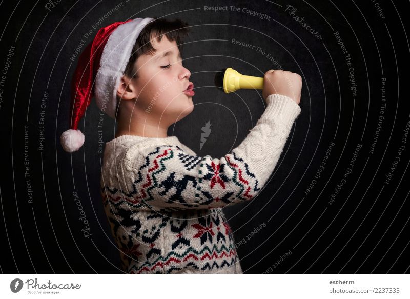 child singing Christmas carol at Christmas Lifestyle Joy Entertainment Party Event Feasts & Celebrations Christmas & Advent New Year's Eve Human being Masculine