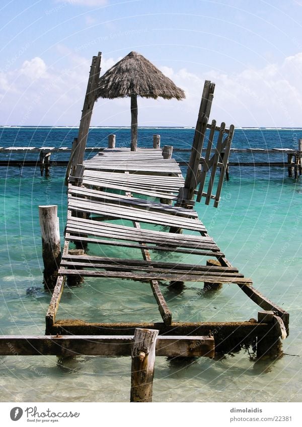 ripe for the island Cancun Ocean Beach Footbridge Wood Horizon Clouds Turquoise Vacation & Travel Mexico Cuba Sand Paradise Umbrella Water Sun Sky Blue