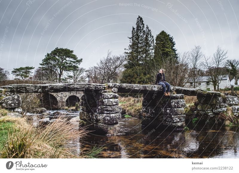 Woman sitting on a stone bridge in Dartmoor, England Lifestyle Well-being Contentment Relaxation Calm Leisure and hobbies Vacation & Travel Trip Adventure