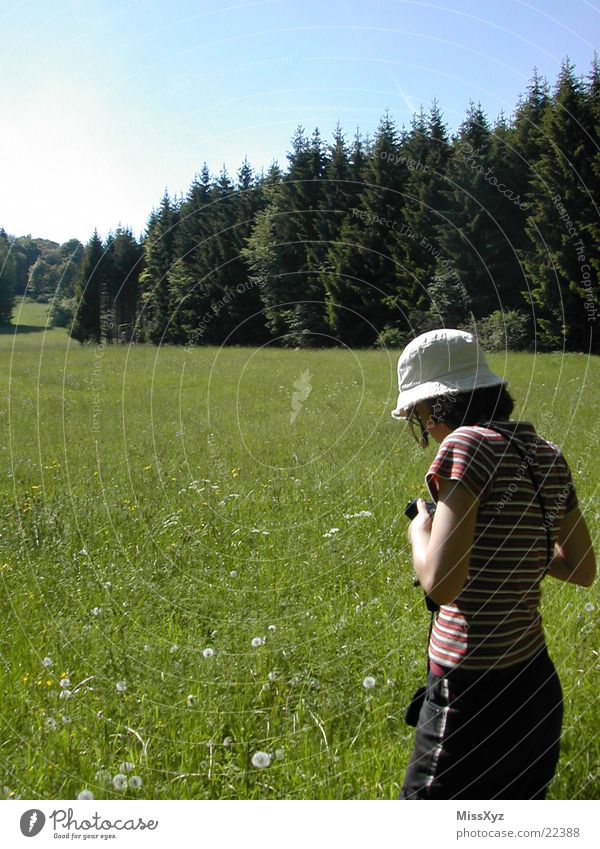 Photographing girl Photography Take a photo Meadow Forest Vacation & Travel Flower Summer Spring Tourist Grass Woman Nature Camera Rhön To go for a walk