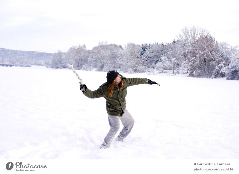 snow dynamics Human being Man Adults Arm 1 30 - 45 years Nature Winter Snow Stick Field Jacket Long-haired Throw Beautiful Uniqueness Cold White Colour photo