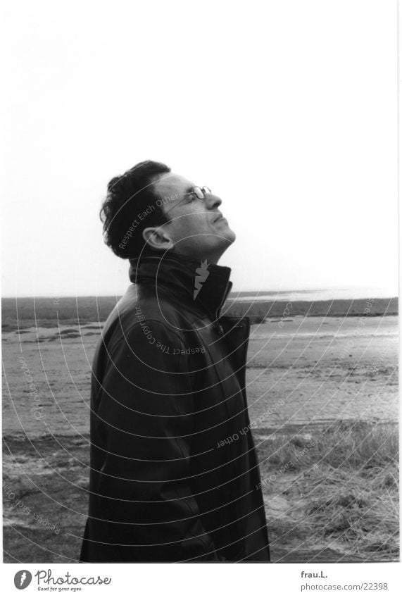 The man and the sea Happy Face Contentment Beach Ocean Winter Human being Man Adults Rain North Sea Serene Calm Loneliness Husum Mud flats To go for a walk