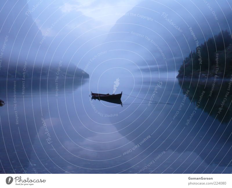 Boat by the fjord Water Autumn Fog Lakeside Fjord Fishing boat Watercraft Blue Calm Loneliness Relaxation Vacation & Travel Colour photo Exterior shot Deserted