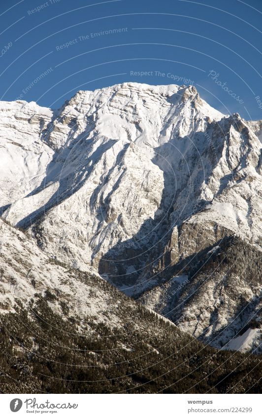 Brilliant mountain weather Environment Nature Landscape Beautiful weather Snow Rock Alps Mountain Peak Snowcapped peak Blue Gray White Tourism Colour photo