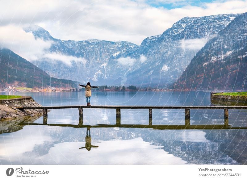 Woman enjoying alpine scenery Vacation & Travel Tourism Freedom Mountain Human being Young woman Youth (Young adults) Adults 1 Nature Alps Lakeside Bridge Think