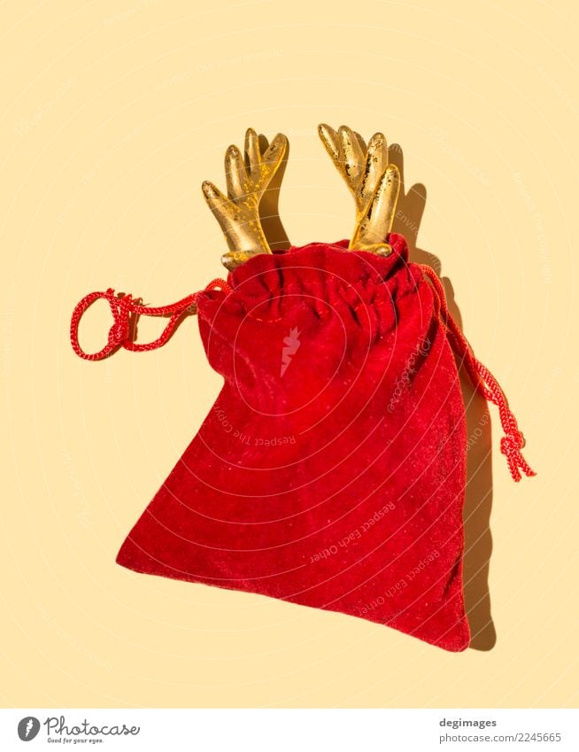 Deer horn in red Santa's bag Design Winter Decoration Feasts & Celebrations Christmas & Advent Hand Animal Red christmas claus Santa Claus Reindeer holiday