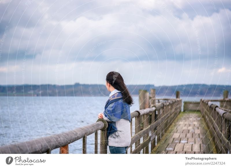 Woman on a bridge looking in the distance Vacation & Travel Tourism Freedom Feminine Young woman Youth (Young adults) 18 - 30 years Adults Nature Horizon Winter