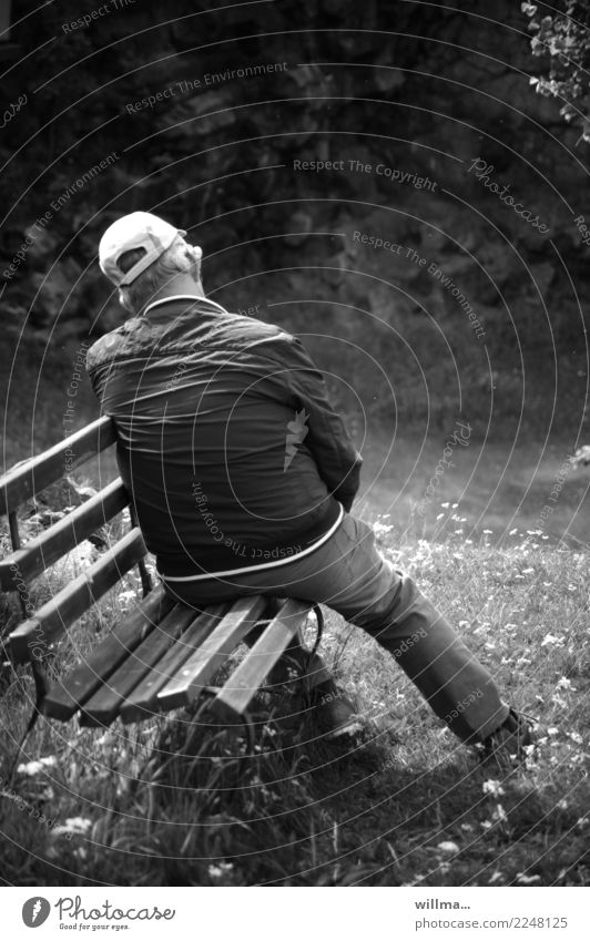 Tired man resting on the bench from hiking Senior citizen Man tired Bench Hiking Trip Retirement Human being Baseball cap Garden bench Park bench Relaxation