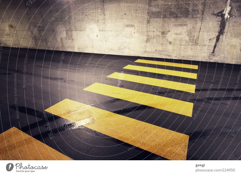 major obstacle Parking garage Wall (barrier) Wall (building) Street Concrete Road sign Line Yellow Gray Black Skid marks Zebra crossing Barrier Closed