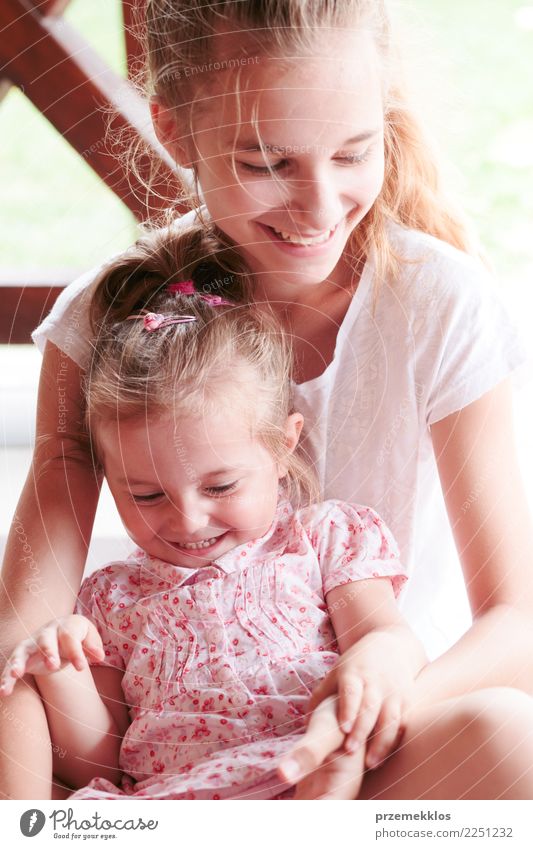 Girl and her little sister spending time together Joy Happy Playing Child Toddler Young woman Youth (Young adults) Sister Family & Relations Infancy 2