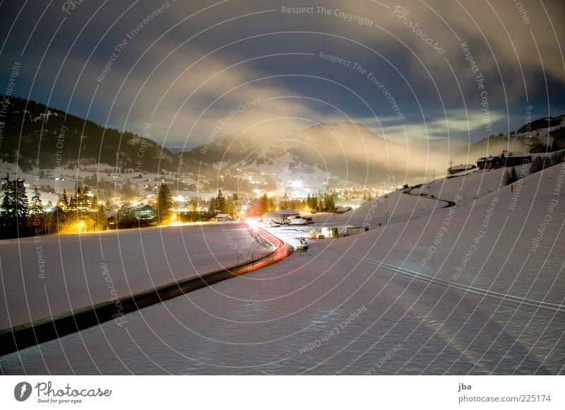 View to Gstaad Relaxation Tourism Winter Snow Winter vacation Mountain Environment Clouds Night sky Beautiful weather Fog Alps Saanenland Switzerland Village