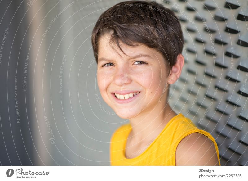 Smiling teen portrait wearing a yellow shirt Lifestyle Relaxation Leisure and hobbies Summer Sports Human being Boy (child) Man Adults Youth (Young adults) Park