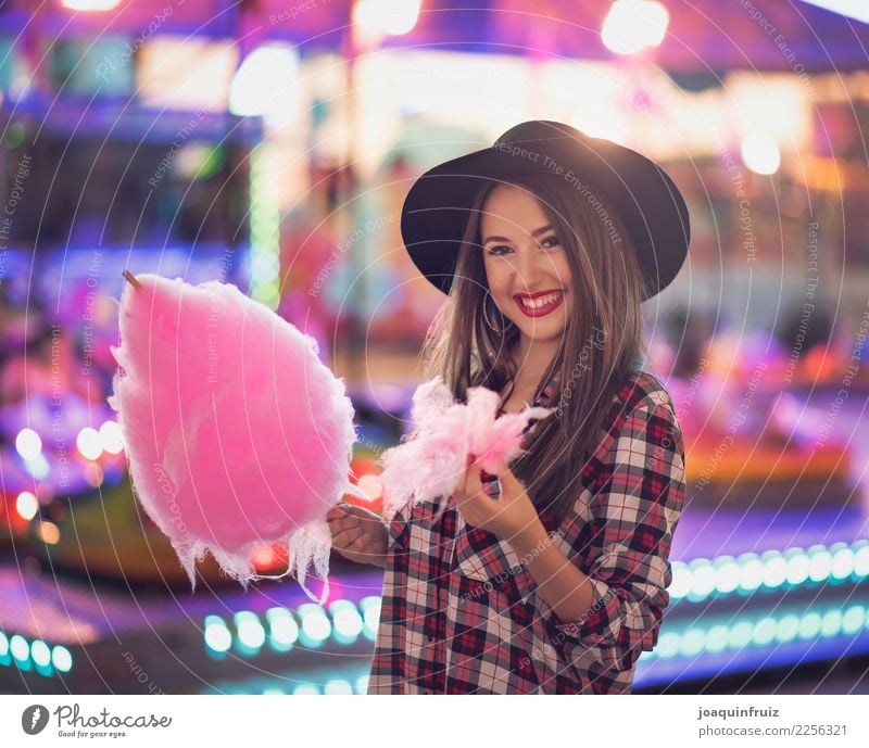 beauty girl with a cotton candy in a fair Lifestyle Joy Happy Beautiful Entertainment Woman Adults Park Hat Happiness White Carousel Amusement Park carnival