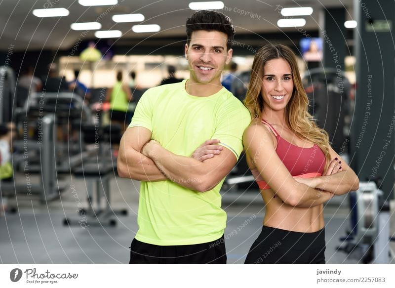 Man and woman personal trainers in the gym. Lifestyle Happy Beautiful Body Sports Human being Masculine Feminine Young woman Youth (Young adults) Young man