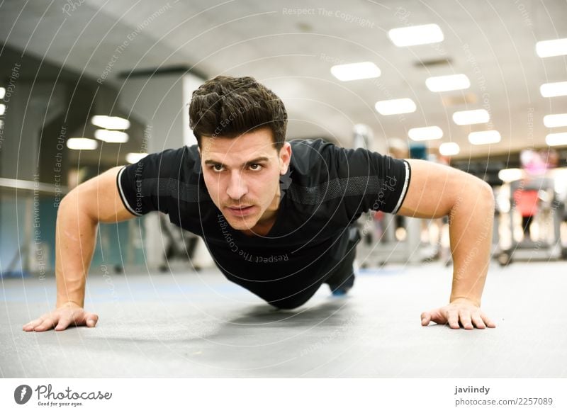 Attractive man doing pushups in the gym. Lifestyle Beautiful Body Sports Human being Young man Youth (Young adults) Man Adults 1 18 - 30 years Fitness Thin