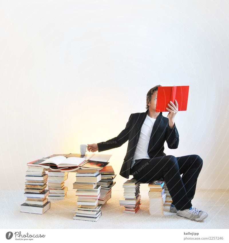 Man in book pile reading a book Lifestyle Relaxation Calm Leisure and hobbies Reading Education Human being Masculine Adults 1 30 - 45 years Study Sit Red Book