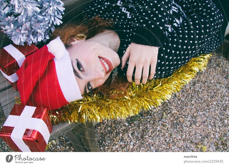 Young happy woman surrounded by christmas decorations Lifestyle Style Joy Beautiful Skin Face Feasts & Celebrations Christmas & Advent New Year's Eve