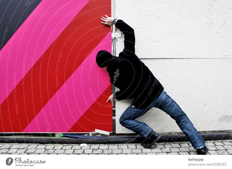 - beyond. Human being Masculine Man Adults 1 Jeans Coat Cap Push Against Resist Pushing Colour photo Multicoloured Exterior shot Full-length Power Rear view Day