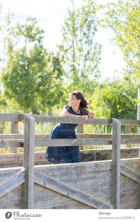 Portrait of a sensual woman on a wooden bridge Lifestyle Elegant Style Beautiful Calm Vacation & Travel Summer Human being Woman Adults Nature Sky River Bridge