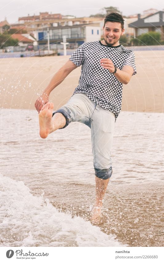 Young man enjoying the day at the beach Lifestyle Joy Wellness Vacation & Travel Tourism Trip Freedom Summer Summer vacation Beach Waves Human being Masculine