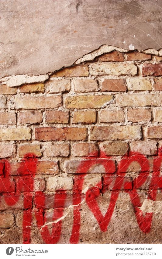 uncovered Facade Diet Red Graffiti Art Street art Wall (barrier) Brick Plaster Characters Letters (alphabet) Dye Deserted Brick wall Broken Capital letter Daub