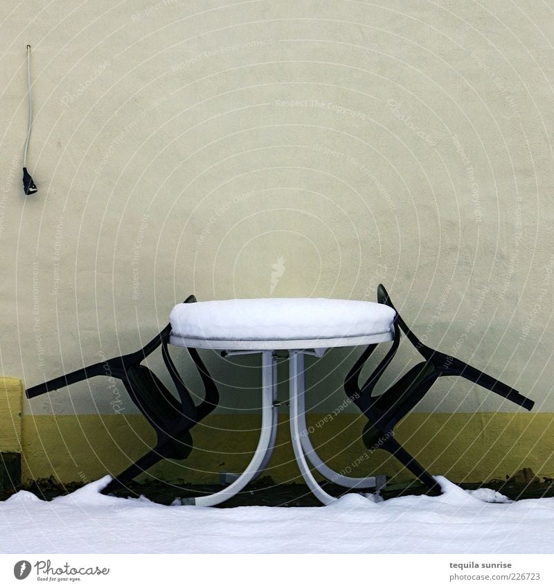 Waiting for summer Winter Weather Snow Garden Facade Terrace Chair Garden chair Table Garden table Wall (building) Cold Gloomy Yellow Green Colour photo